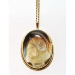 Carved citrine pendant, in 9ct gold, on necklet.