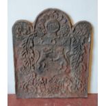 Charles II cast iron fire back with impressed crest, dated 1677, 84cm high and 69cm wide.