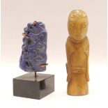 Oriental carved hardstone toggle in the form of a deity, possibly Guanyin, 8cm high; also a small