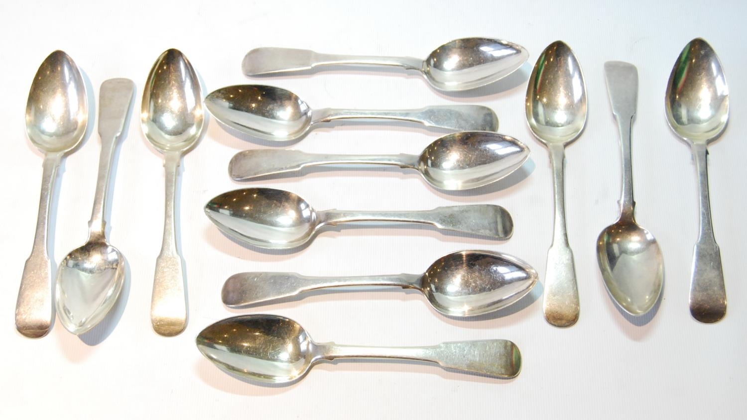 Set of twelve silver fiddle pattern dessert spoons, probably by Thomas Stewart, Dundee c. 1860, 355g