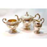 Silver three-piece tea set of half ovoid shape, embossed with rococo scrolls, by William Mortimer or