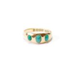 Turquoise three-stone ring, gipsy-set, in 18ct gold, 1909, size O, 2.6g.