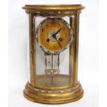 Late 19th century French brass and champlevé enamel four glass mantel clock, the gilded dial with