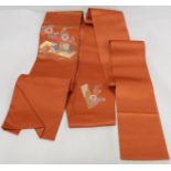 Japanese Obi sash of orange silk with brocade small panels of flowers in polychrome and gold