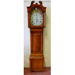 Victorian mahogany eight day longcase clock, the hood with scroll pediment above a painted dial with