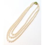 Three-row choker necklace of graduated cultured pearls, on 9ct gold snap with peridot and pearls.