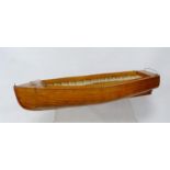 Wooden model of a sailing boat, 47cm long, with a wooden box.