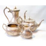 Silver four-piece tea and coffee set, ovoid with foliate and fluted embossing, by Deakins, Sheffield