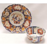 Japanese Imari circular fluted bowl with double indented foot rim and panels of flowers and foliage,