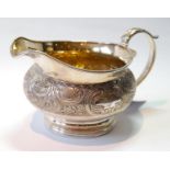 Aberdeen: good silver cream jug of compressed circular form with embossed band and gilt interior, on