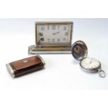 Eight day boudoir timepiece of Art Deco style, rectangular, upon stepped base, a silver lever pocket