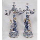 Pair of late 19th/early 20th century continental blue and white porcelain candelabra, the detachable
