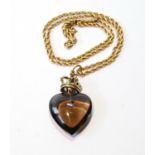 Smoky quartz heart pendant with gold mount and necklace, '15ct'.