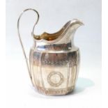 Silver cream jug of panelled ovoid shape, fluted corners and engraved bands, maker C & B (untraced),