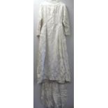 Vintage wedding dress, probably 1960's, in white floral satin damask with high round neck, fitted