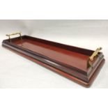Victorian or Edwardian narrow mahogany tray or decanter stand of rectangular form with twin brass