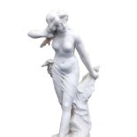 A Cipriani (Italian) White marble figure modelled as a scantily clad female standing on a rock,