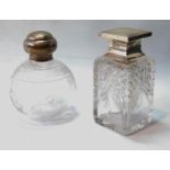 Cut glass scent bottle of square section and another, globular, with silver mounts.  (2)