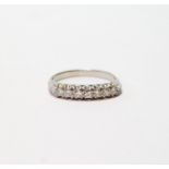 Diamond seven-stone ring with small brilliants, in platinum, size O, 4.3g.