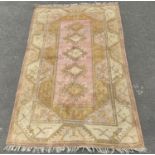Turkish hand-knotted rug decorated with five geometric and floral medallions to the centre, on a