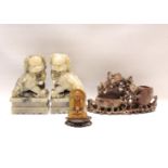 Pair of oriental soapstone figures of Dogs of Fo seated on rectangular plinth bases, each 18cm high,