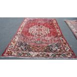 Persian Bakhtiari rug decorated with all-over geometric motifs on a multi-coloured ground, 300cm x