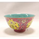 Chinese porcelain bowl of circular form, the exterior with yellow floral panels on pink floral