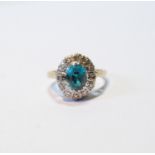 Blue zircon and diamond oval cluster ring, '18ct pt', size K.