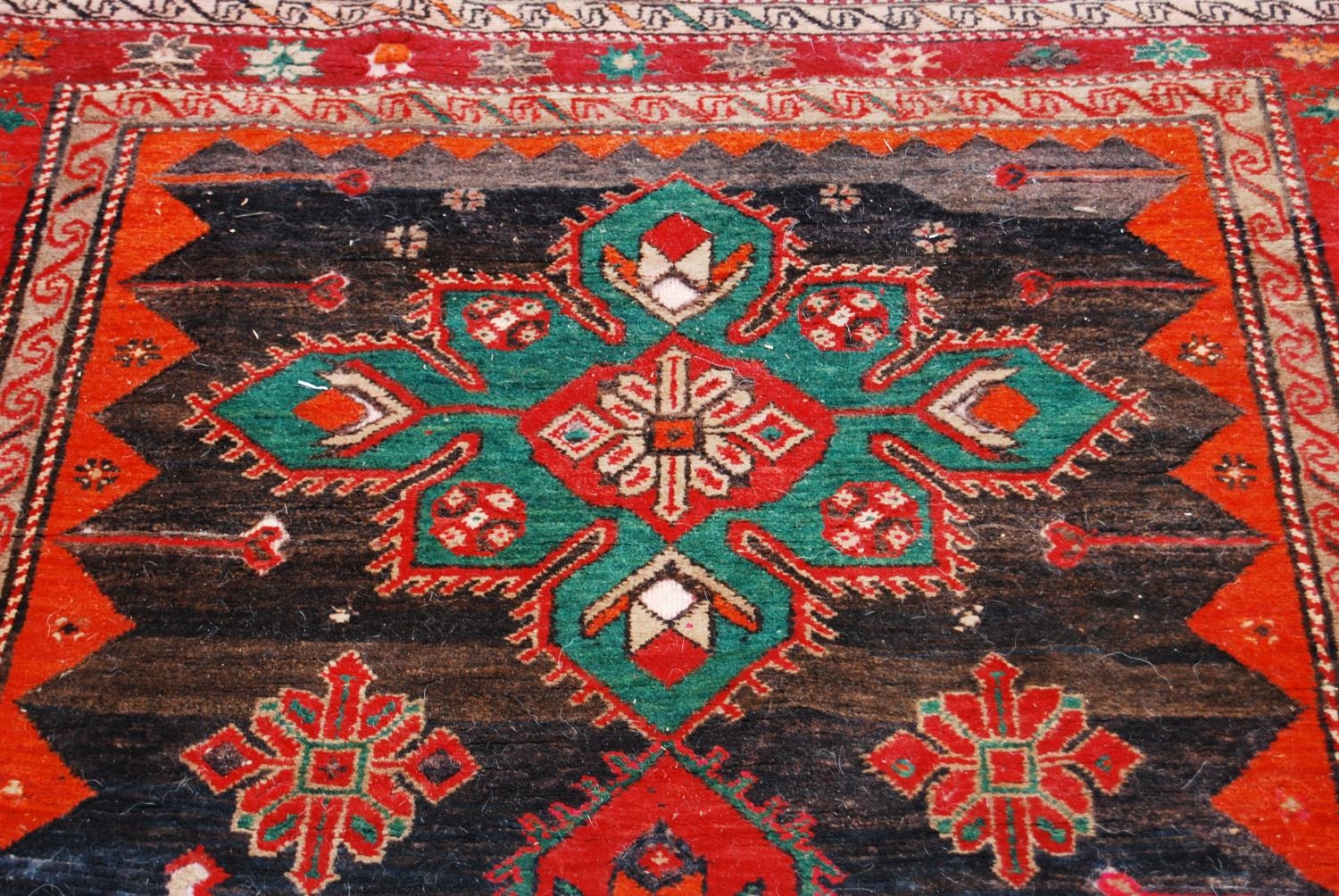 Afghan Belouch hand-knotted rug decorated with two large geometric motifs to the centre, on a red - Image 4 of 5