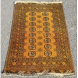 Afghan Bokhara hand-knotted rug decorated with eight rows of two geometric medallions, on an