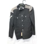 British Army uniform, a black jacket having Northumberland Hussars buttons and collar badges,