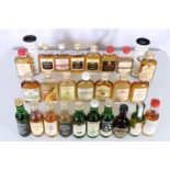 A good selection of twenty-seven single malt whisky miniatures including BOWMORE 70° proof (