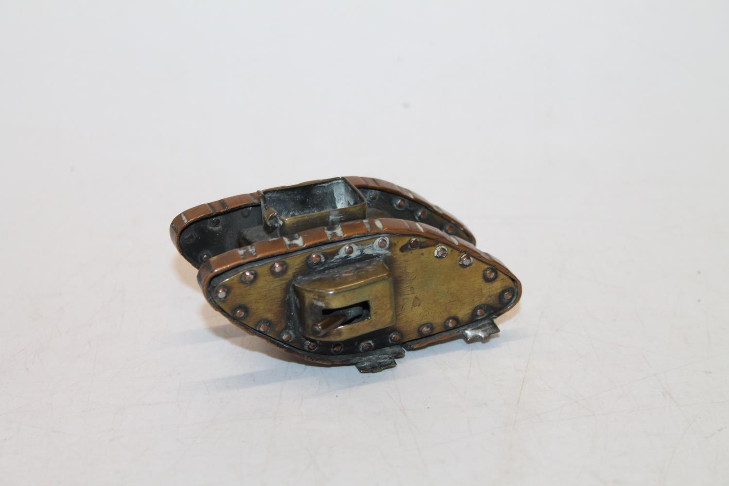 Copper and brass "Trench Art" table snuff box modelled a WWI tank, 9cm long.