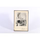 Photographic print of the Queen Mother resting on a mantle piece, signed "Elizabeth R" below, both