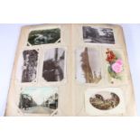 An Edwardian Art Nouveau style postcard album containing around 80 postcards, mostly of