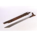 Borneo Dyak mandau or parang ilang headhunters sword with craved wood grip and scabbard, blade