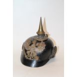 WWI era Imperial German Pickelhaube spiked helmet with helmet badge depicting eagle holding orb