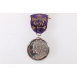 An unusual George V Coronation medal 1911, the reverse with banners "GREAT BRITAIN, AUSTRALASIA,