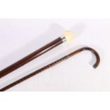 Walking stick with synthetic ivory ball handle and another, (2).