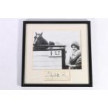 Photographic print of the Queen Mother with her winning horse, signed "Elizabeth R" below, both