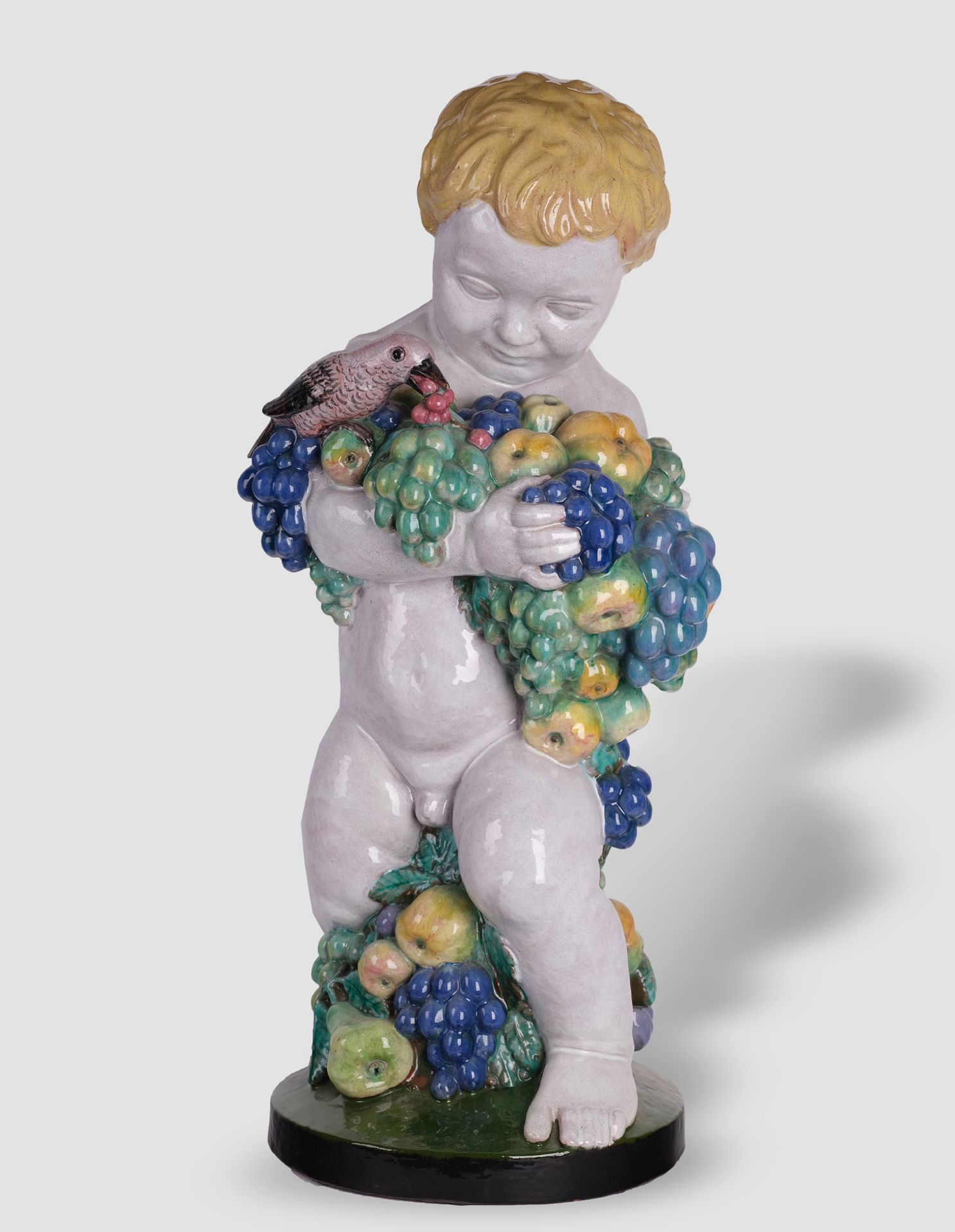 Michael Powolny, Judenburg 1871 – 1954 Vienna, Large putto with fruits and bird