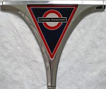 London Transport Routemaster RADIATOR BADGE complete with original grille surround piece. It is