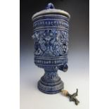 A German Westerwald stoneware water filter and cover, 19th century, the body extensively relief