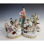 Seven British and Continental porcelain figural groups, to include; a pair of putti groups depicting