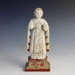 An Indo-Portuguese ivory carving of a Catholic Saint, Goa - 18th century, modelled standing with