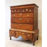 An early 18th century oak chest on stand, the moulded cornice above a cushion frieze drawer and