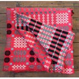 A Welsh blanket, of traditional reversible geometric design in red, white and black, unlabelled,