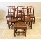 A matched set of six oak country chairs, comprising a pair of 18th century oak chairs with pierced