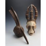 A West African Nigerian Igbo mask, 53cm high, and a West African Bwa tribe bird shaped mask, 61cm