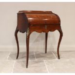 A Louis XV style walnut cylinder bureau, late 19th century, the pagoda shaped top above a sliding